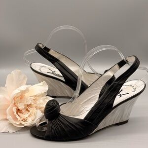 Yves Saint Laurent (YSL) slingback with a ruched vamp and a decorative knot